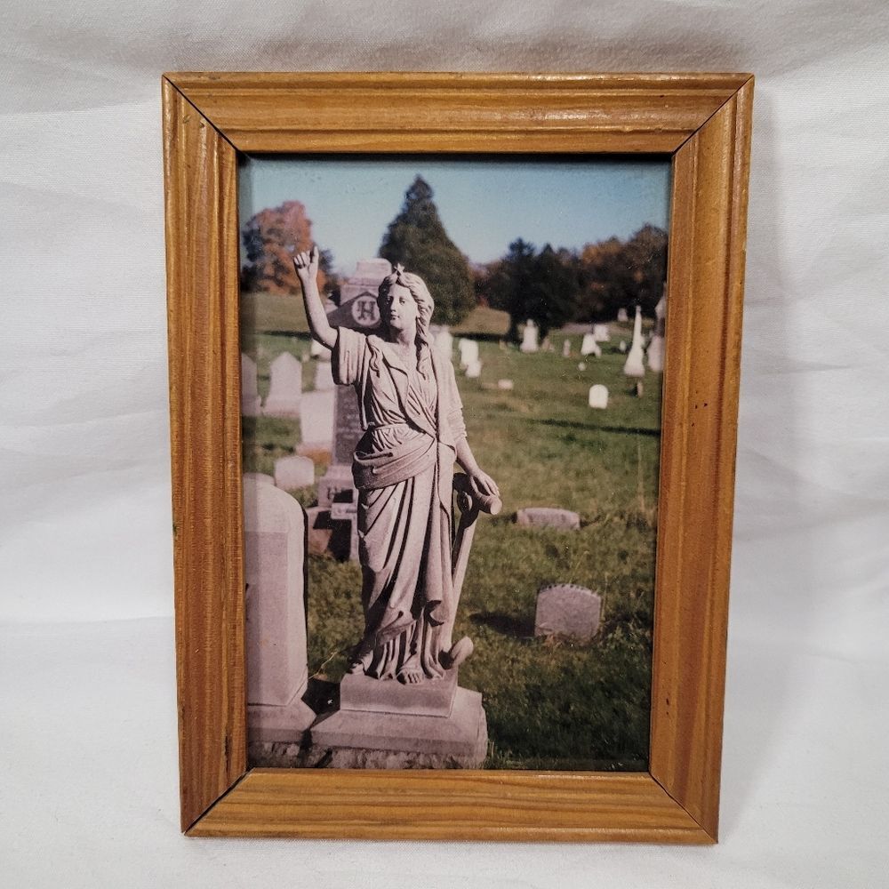 Wooden Frame with Statue Photograph